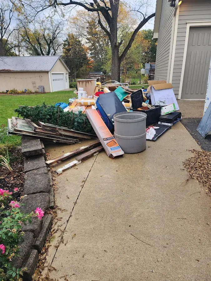 Dumpster being loaded with debris for Residential Dumpster Rental in Butte